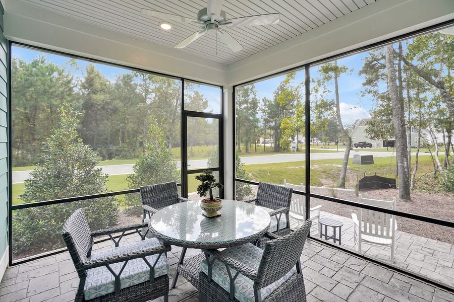 Exterior details and patio area of a home in The Bluffs On the Cape Fear, Leland (Image 21).