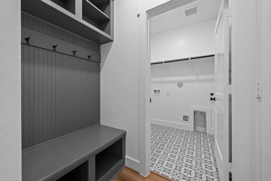 This thoughtful built-in storage in the Family Foyer, also located adjacent to the Utility Room, helps to keep your drop zone uncluttered. This thoughtful built-in storage in the Family Foyer, also located adjacent to the Utility Room, helps to keep your drop zone uncluttered.