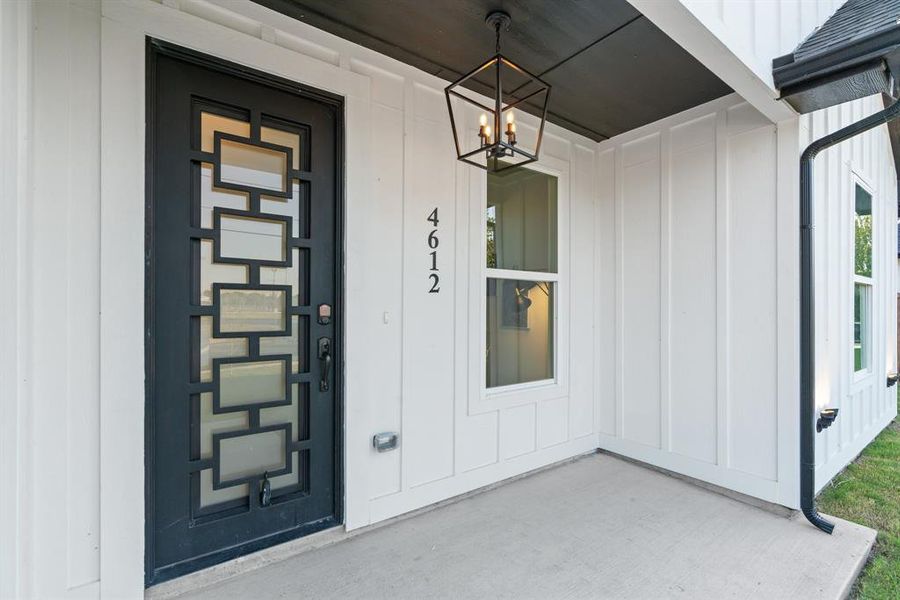 View of exterior entry featuring a porch