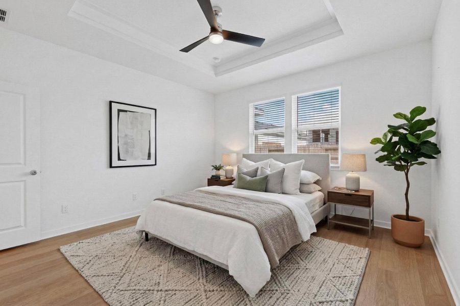 Bedroom featuring a ceiling fan and light wood-style flooring