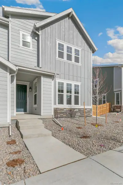 Exterior details and patio area of a home in Turnberry Villas, Commerce City (Image 4).