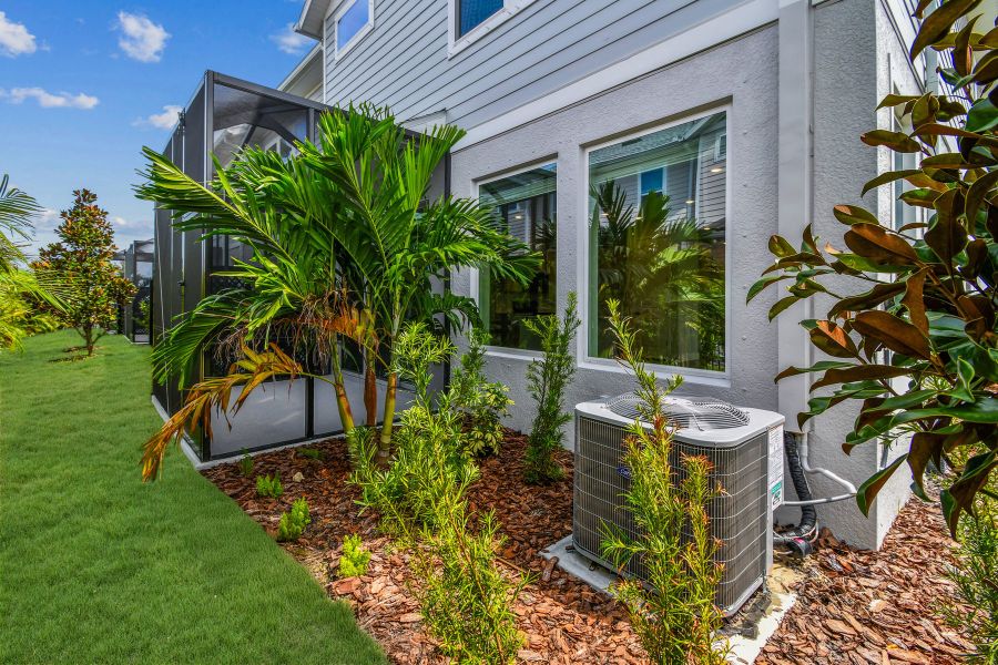 Exterior details and patio area of a home in North River Ranch – Townhomes, Parrish (Image 3).