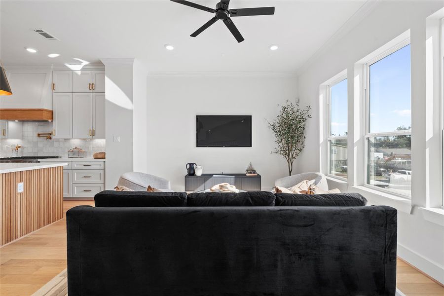 A bright, elegantly styled living space featuring modern decor, soft neutral palettes, and windows that flood the room with natural light. A bright, elegantly styled living space featuring modern decor, soft neutral palettes, and windows that flood the room with natural light.