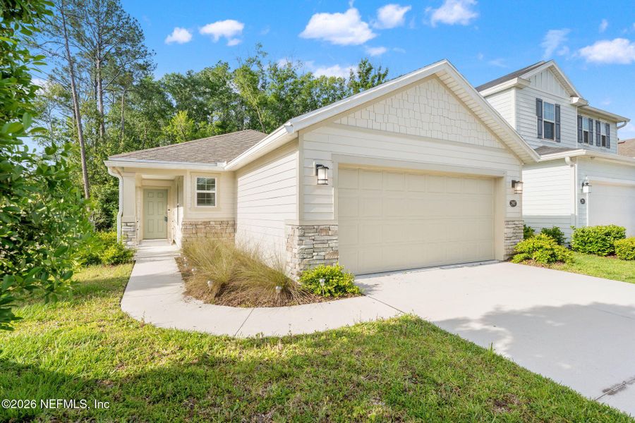 Front exterior of a new home in Pinewood Place, Middleburg, FL, highlighting curb appeal (Image 17). Front exterior of a new home in Pinewood Place, Middleburg, FL, highlighting curb appeal (Image 17).