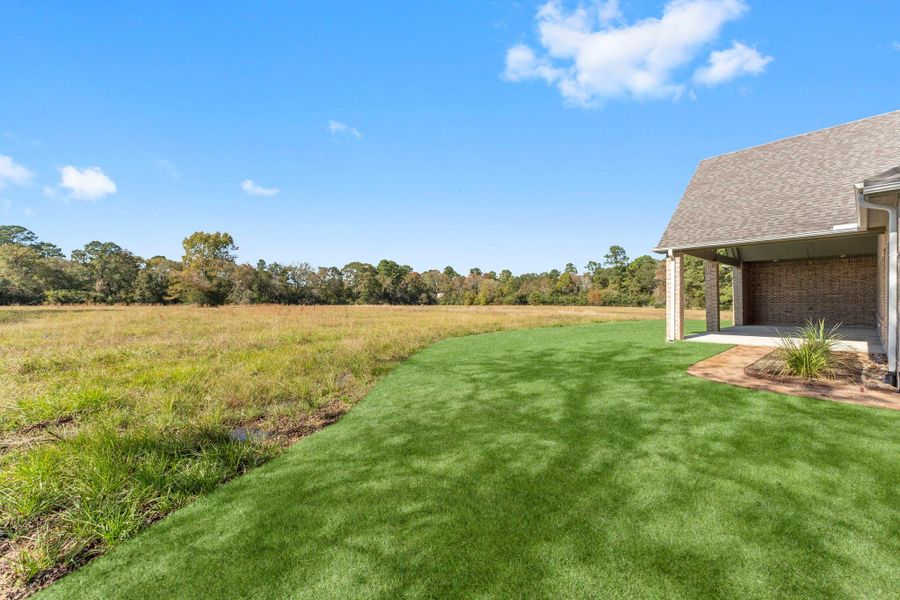 Exterior details and patio area of a home in Homestead Hill, New Waverly (Image 3).
