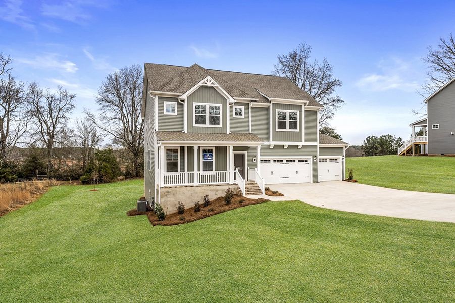 Front exterior of a new home in Ridgecrest at Midway, Anderson, SC, highlighting curb appeal (Image 23).