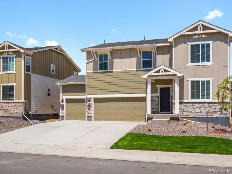 Front exterior of a new home in Revere at Johnstown, Johnstown, CO, highlighting curb appeal (Image 1). Front exterior of a new home in Revere at Johnstown, Johnstown, CO, highlighting curb appeal (Image 1).
