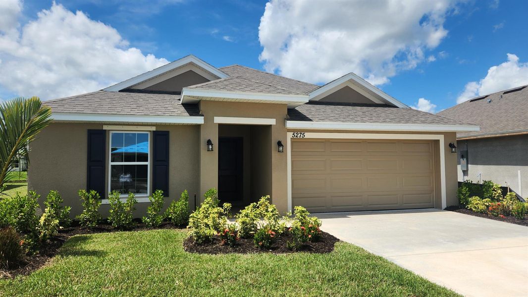 Front exterior of a new home in , Fort Pierce, FL, highlighting curb appeal (Image 15).