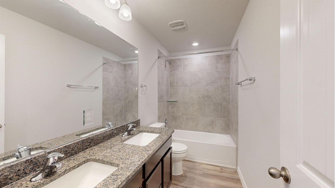 Double vanity with granite countertops and undermount sinks Double vanity with granite countertops and undermount sinks