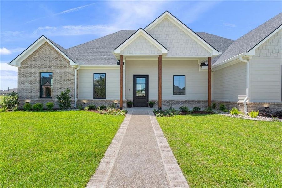 Front exterior of a new home in , Robinson, TX, highlighting curb appeal (Image 2). Front exterior of a new home in , Robinson, TX, highlighting curb appeal (Image 2).