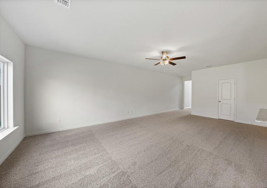 The spacious family room is perfect for family living and hosting.