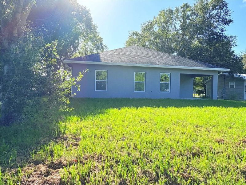 Front exterior of a new home in , Okeechobee, FL, highlighting curb appeal (Image 23).