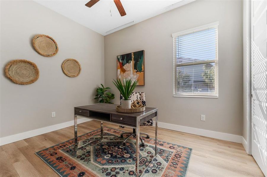 Downstairs bedroom staged as an office