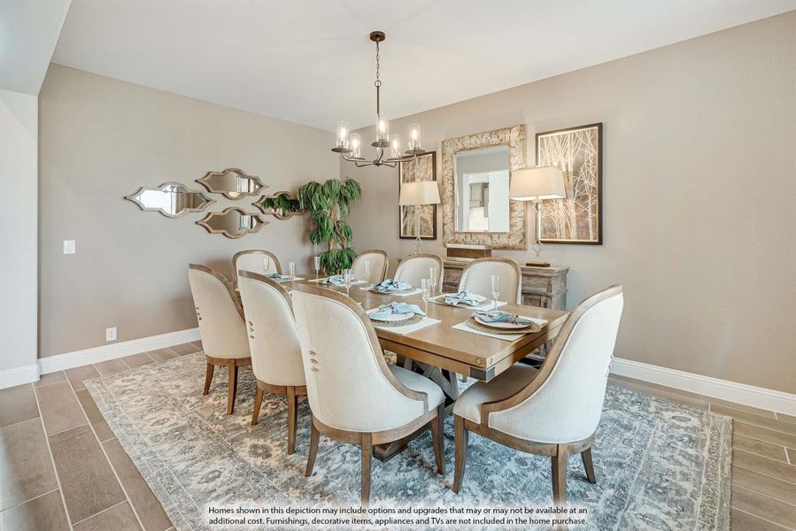 Dining room with large wood table, eight upholstered chairs, chandelier, and decorative mirrors on beige walls