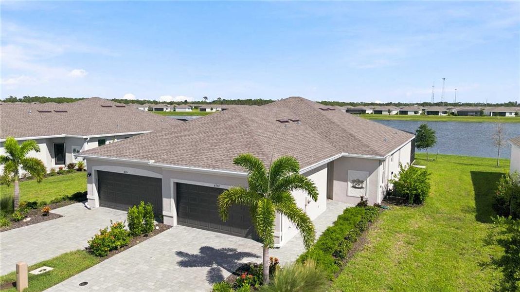 Front exterior of a new home in , Englewood, FL, highlighting curb appeal (Image 23). Front exterior of a new home in , Englewood, FL, highlighting curb appeal (Image 23).