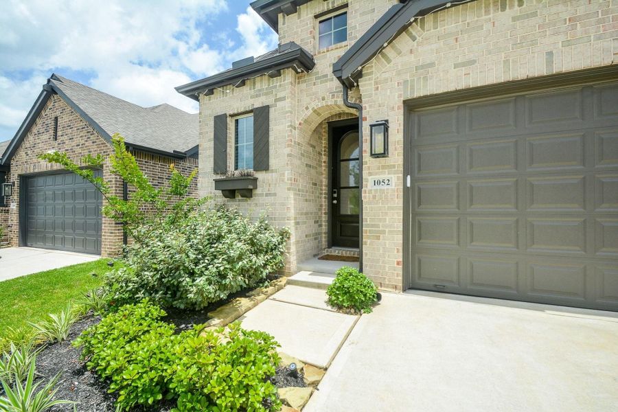 Spacious driveway and attached two car garage offer everyday convenience. Spacious driveway and attached two car garage offer everyday convenience.