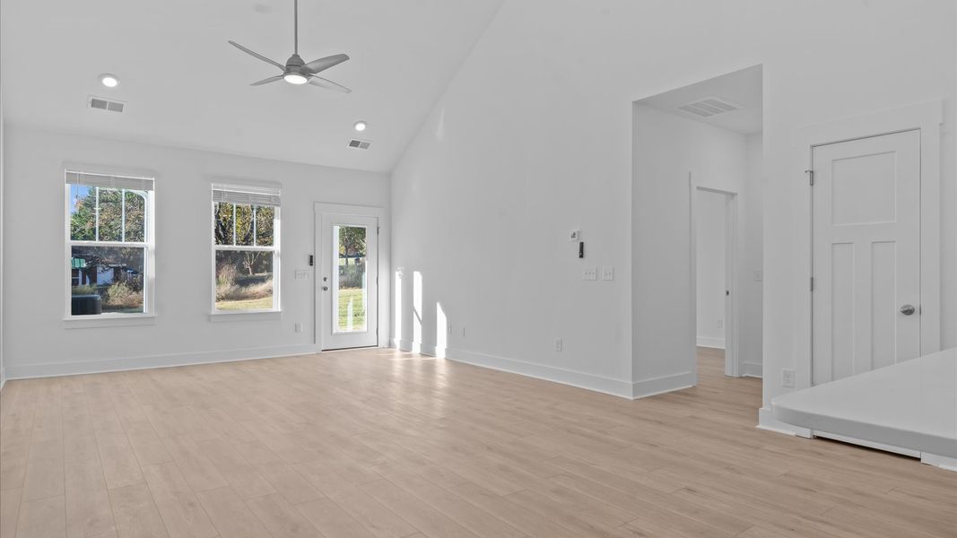 Highly skilled craftsmanship and modern elegance meet in this family room with soaring ceilings