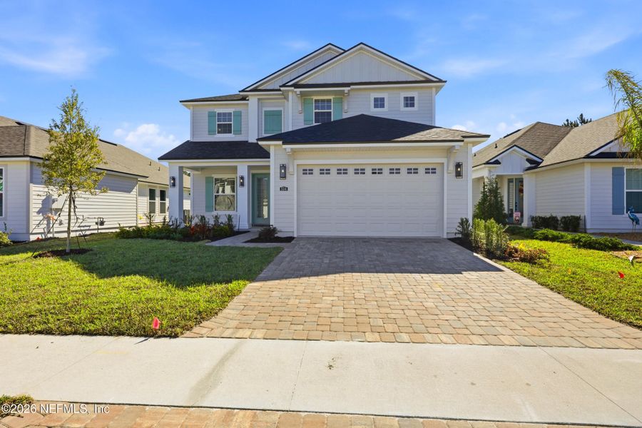 Front exterior of a new home in Silver Landing At Silverleaf, St. Augustine, FL, highlighting curb appeal (Image 26).