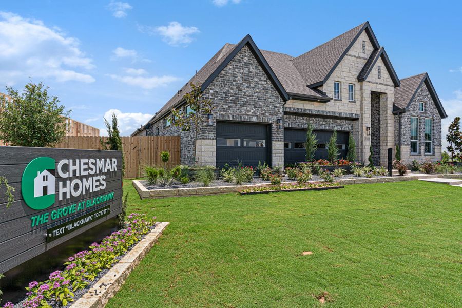 Front exterior of a new home in The Grove at Blackhawk, Pflugerville, TX, highlighting curb appeal (Image 26). Front exterior of a new home in The Grove at Blackhawk, Pflugerville, TX, highlighting curb appeal (Image 26).