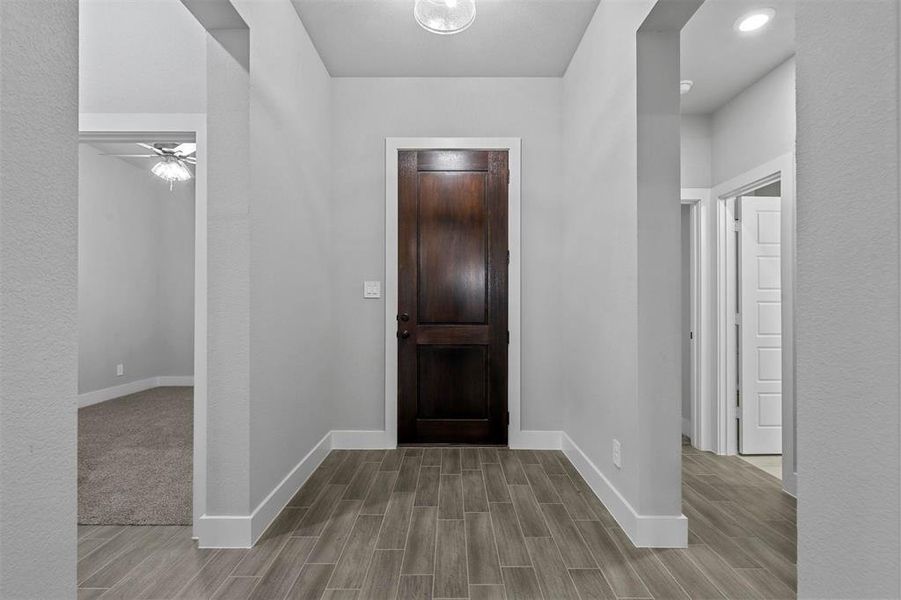 Foyer featuring ceiling fan and light hardwood / wood-style flooring