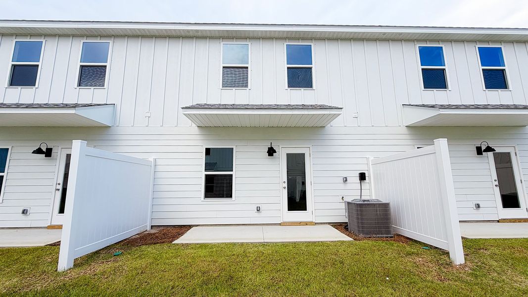 Exterior details and patio area of a home in Salt Creek Townhomes at Mexico Beach, Mexico Beach (Image 3).