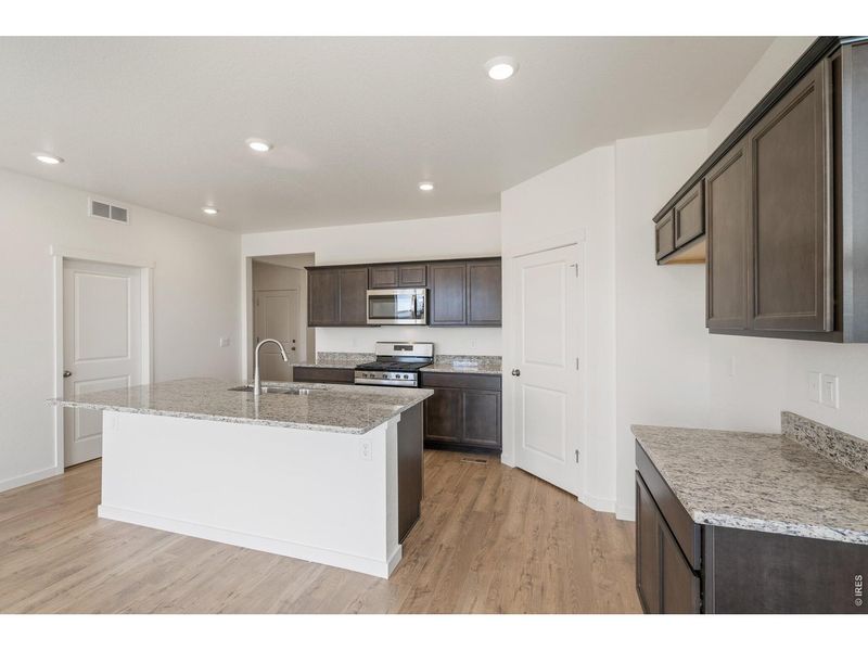 Furnished interior view inside a new home in Westgate, Greeley (Image 9).