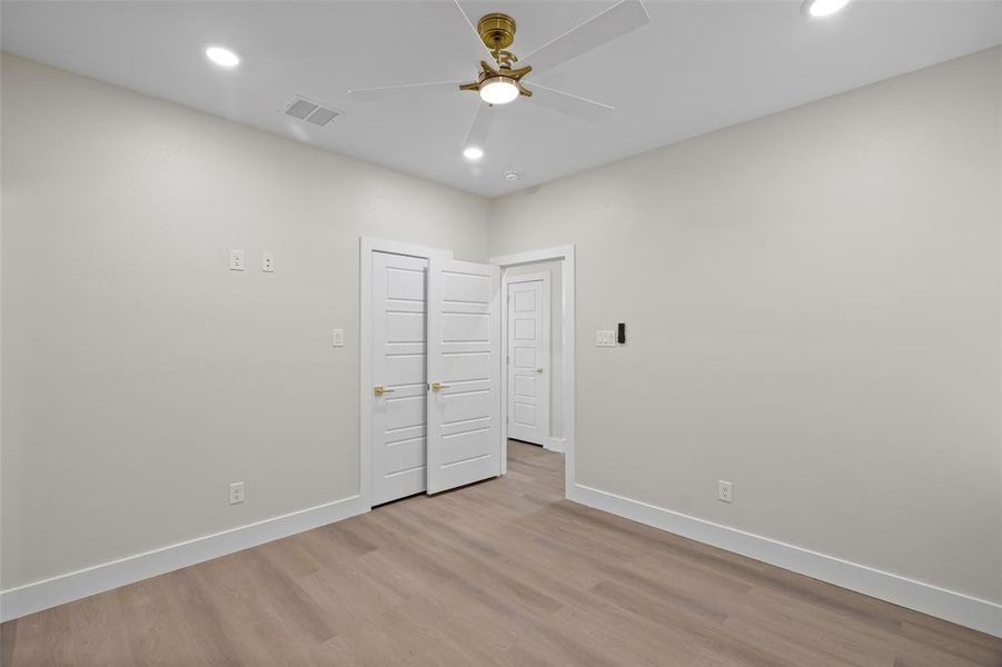 Primary bedroom with ceiling fan