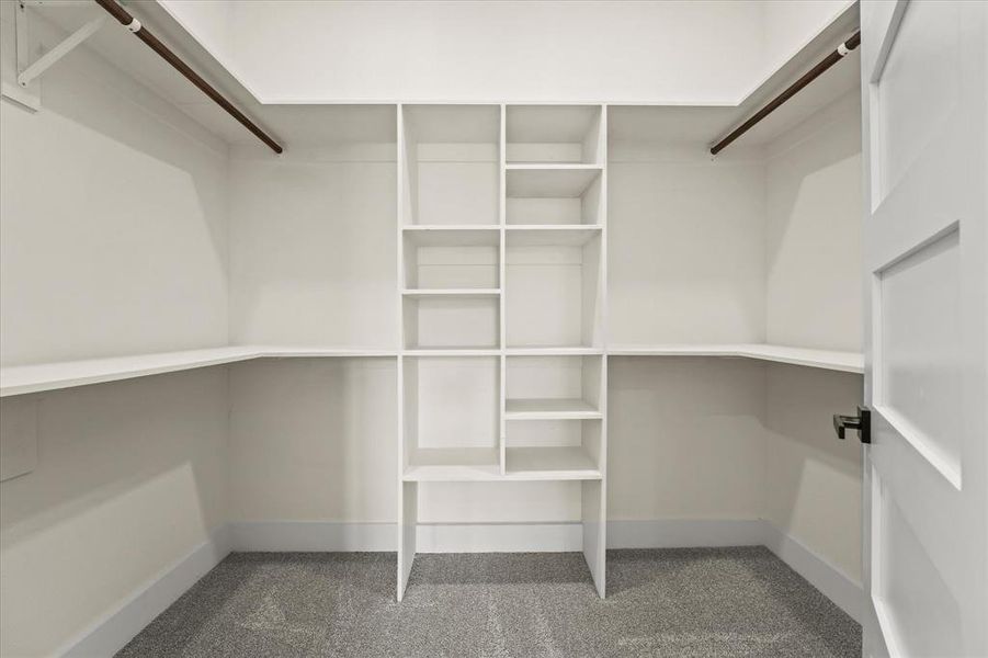 Spacious closet with carpet floors Spacious closet with carpet floors