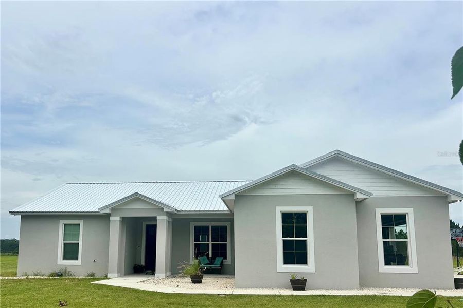 Front exterior of a new home in , Fort Meade, FL, highlighting curb appeal (Image 1). Front exterior of a new home in , Fort Meade, FL, highlighting curb appeal (Image 1).