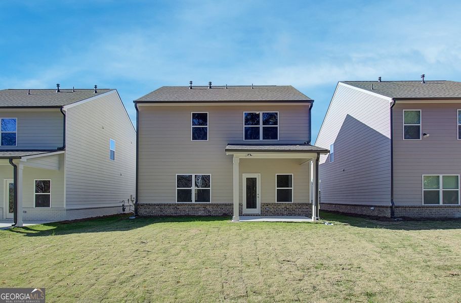 Front exterior of a new home in Crofton Place Enclave, Snellville, GA, highlighting curb appeal (Image 1). Front exterior of a new home in Crofton Place Enclave, Snellville, GA, highlighting curb appeal (Image 1).