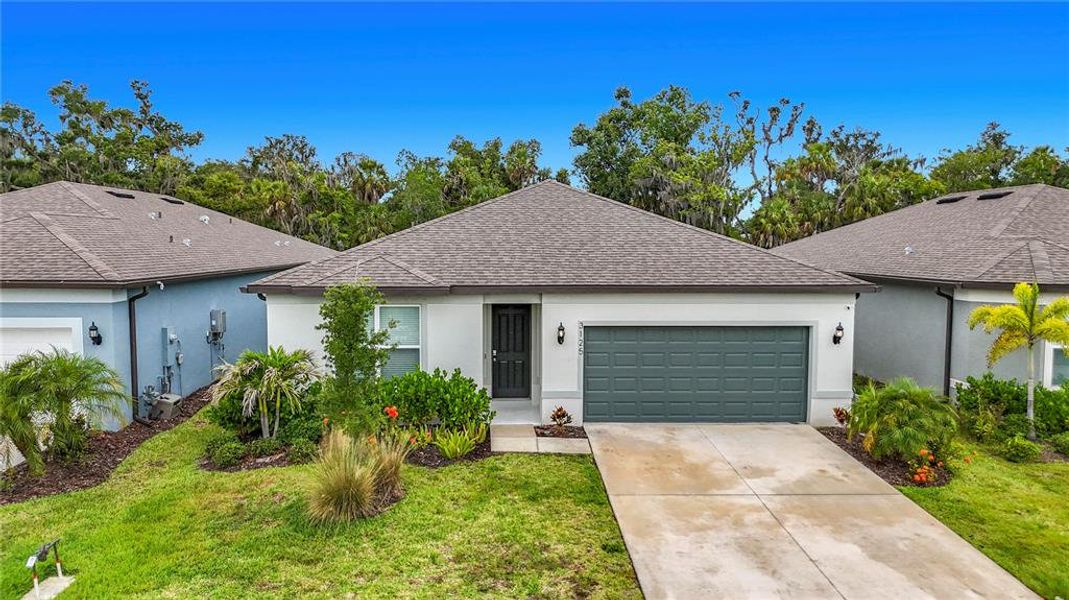Front exterior of a new home in , Ellenton, FL, highlighting curb appeal (Image 26). Front exterior of a new home in , Ellenton, FL, highlighting curb appeal (Image 26).