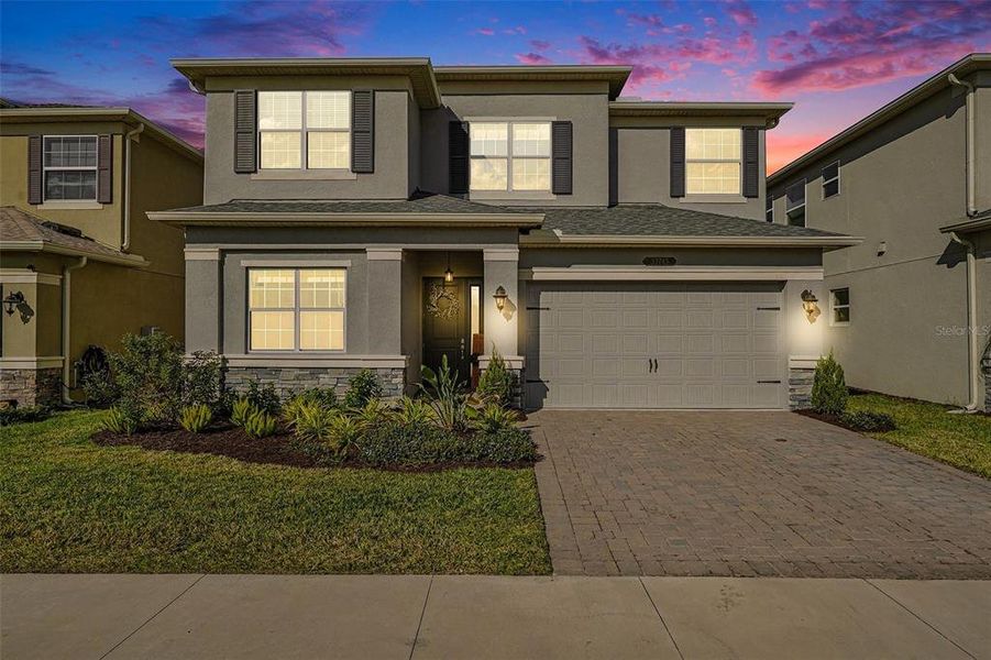 Front exterior of a new home in , Wesley Chapel, FL, highlighting curb appeal (Image 2). Front exterior of a new home in , Wesley Chapel, FL, highlighting curb appeal (Image 2).