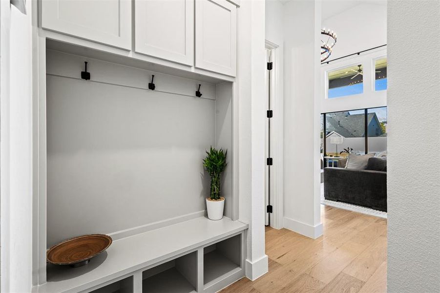 Mudroom with light wood-type flooring and baseboards Mudroom with light wood-type flooring and baseboards