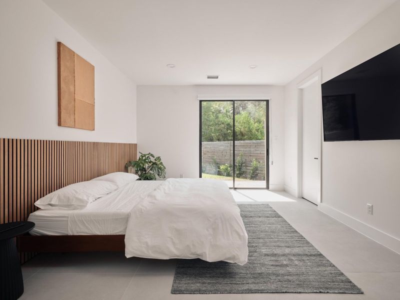 Primary bedroom with private access to side yard