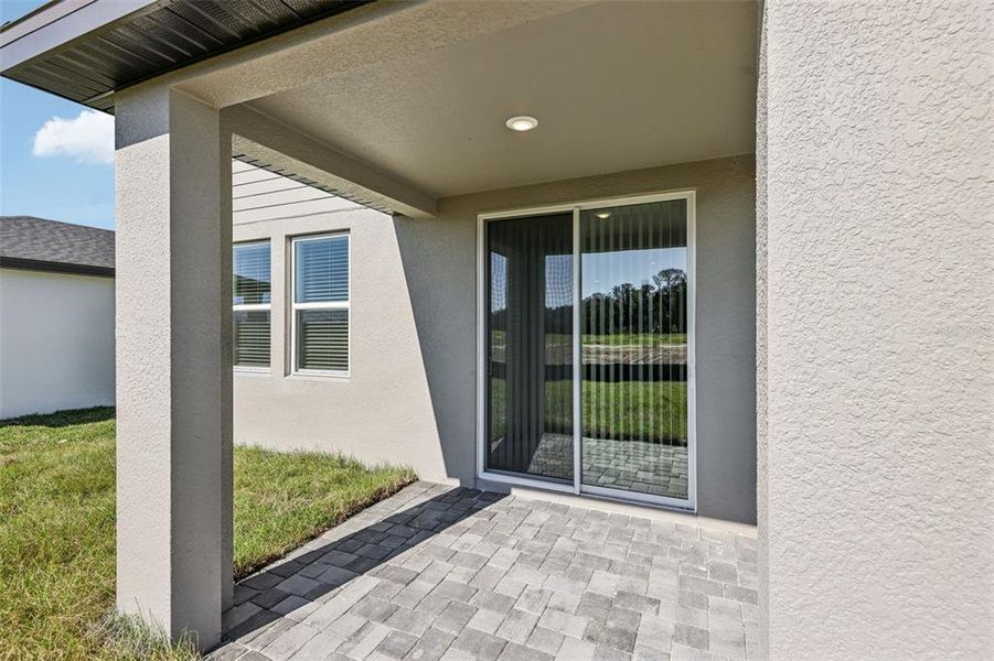 Exterior details and patio area of a home in The Reserve at Hammock Oaks - Classic Series, Lady Lake (Image 30).