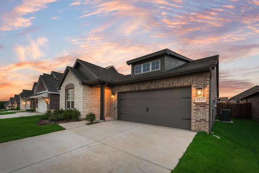 Front exterior of a new home in Liberty Pointe, Gainesville, TX, highlighting curb appeal (Image 15).