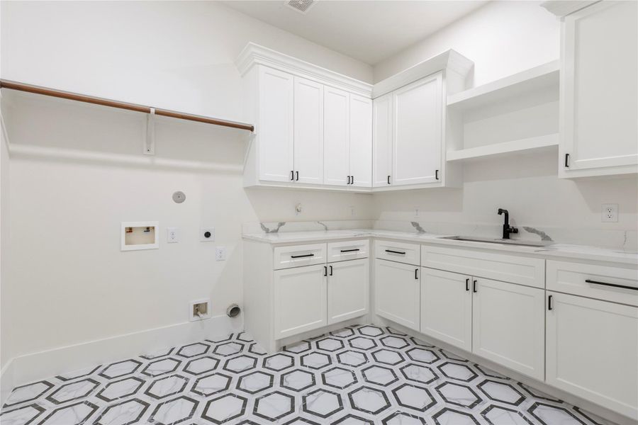 The utility room is a show-stopper. If offers plenty of storage cabinets. Designer tile floors. Wet sensors have been added throughout the home in every area with water. This will give you peace of mind while you are away on vacation. The utility room is a show-stopper. If offers plenty of storage cabinets. Designer tile floors. Wet sensors have been added throughout the home in every area with water. This will give you peace of mind while you are away on vacation.
