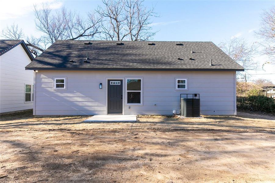 Back of house with central air condition unit