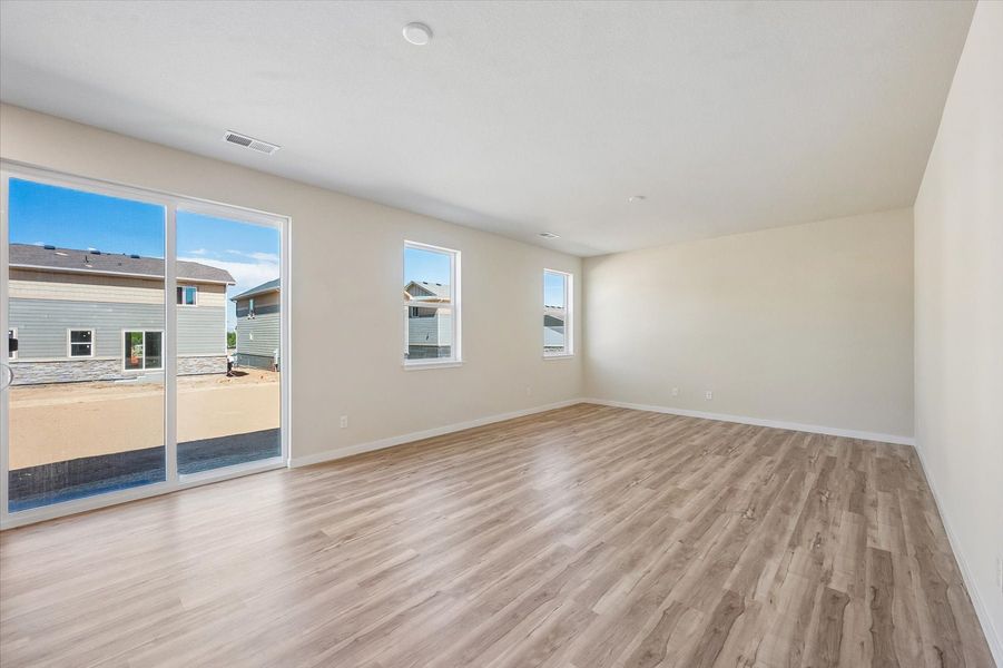 A room with a wood floor and a wood floor.