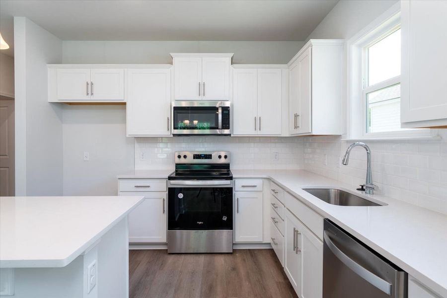 Open Kitchen with white cabinets and granite countertops. Open Kitchen with white cabinets and granite countertops.