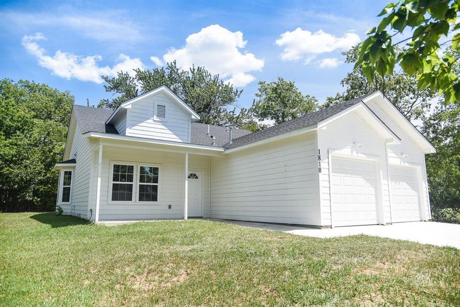 Front exterior of a new home in , Commerce, TX, highlighting curb appeal (Image 2). Front exterior of a new home in , Commerce, TX, highlighting curb appeal (Image 2).
