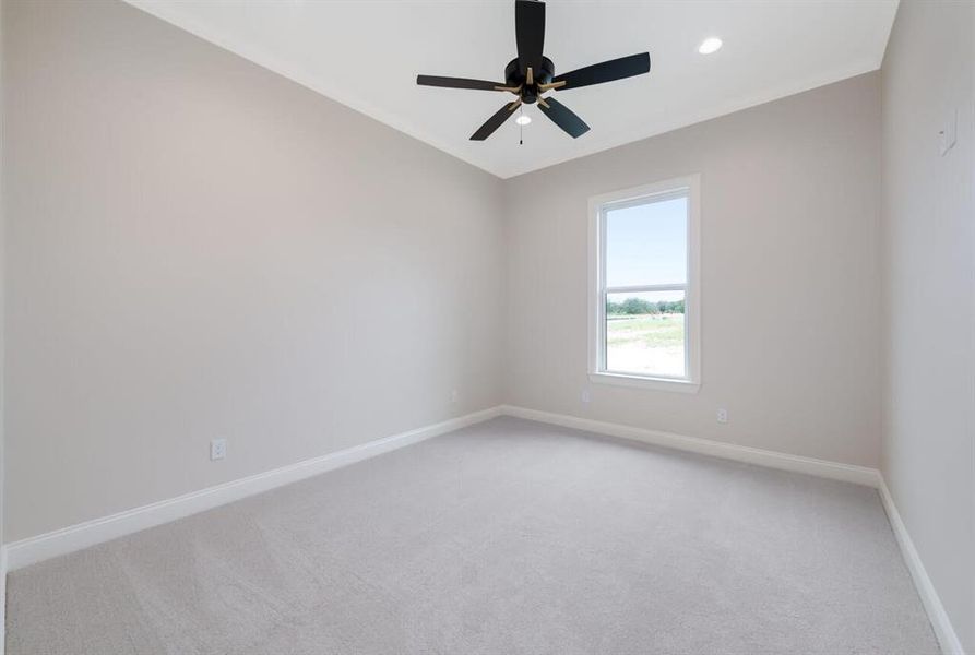 Spare room with light carpet, a ceiling fan, recessed lighting, and ornamental molding Spare room with light carpet, a ceiling fan, recessed lighting, and ornamental molding