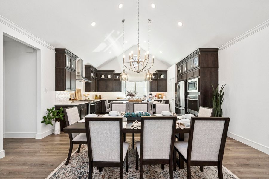 Dining area and kitchen with vaulted ceiling Dining area and kitchen with vaulted ceiling