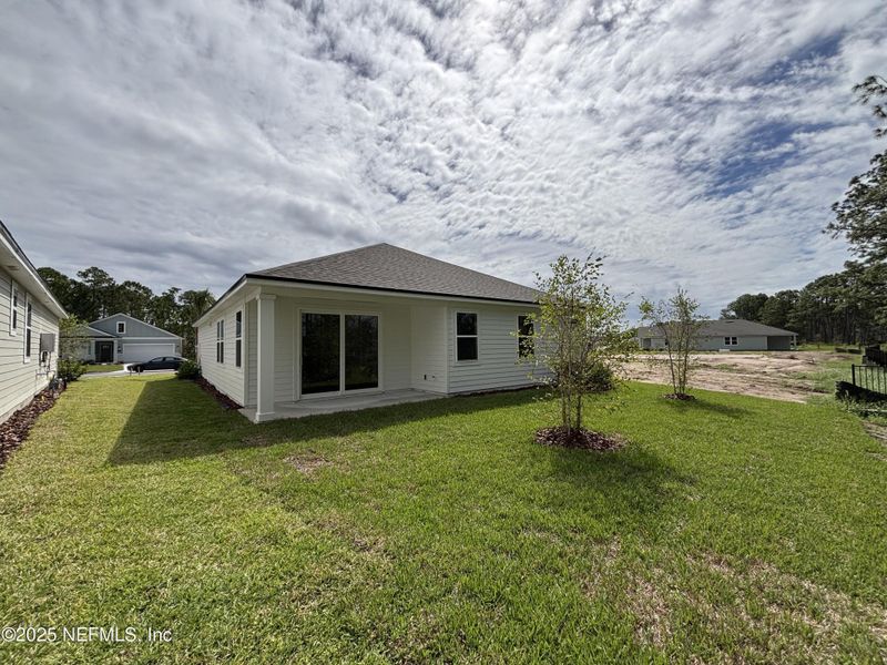 Exterior details and patio area of a home in The Magnolia Series at Reserve East, Flagler Beach (Image 17).