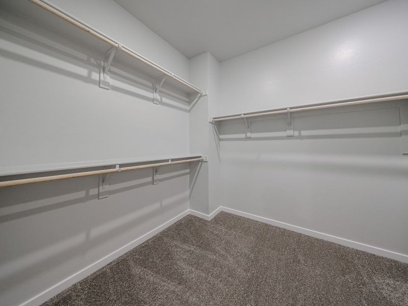 A white room with a staircase.