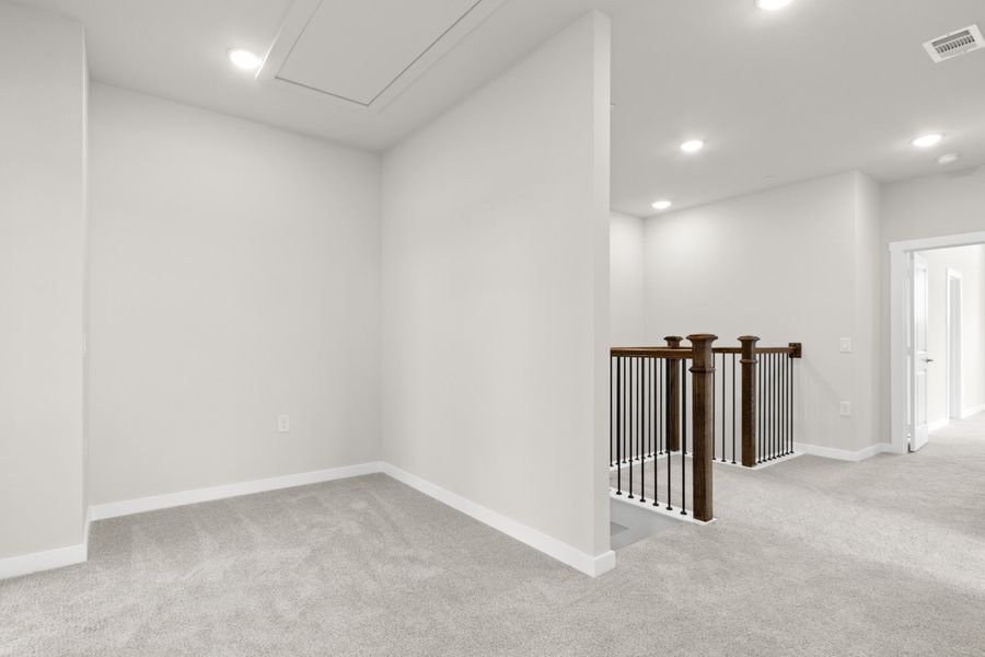 Spacious, unfurnished interior of a new home in The Tribute, The Colony (Image 24).
