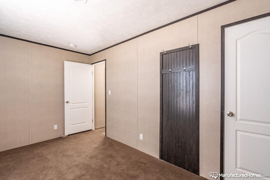 A well-maintained interior space showcasing durable carpet flooring and paneled walls.
