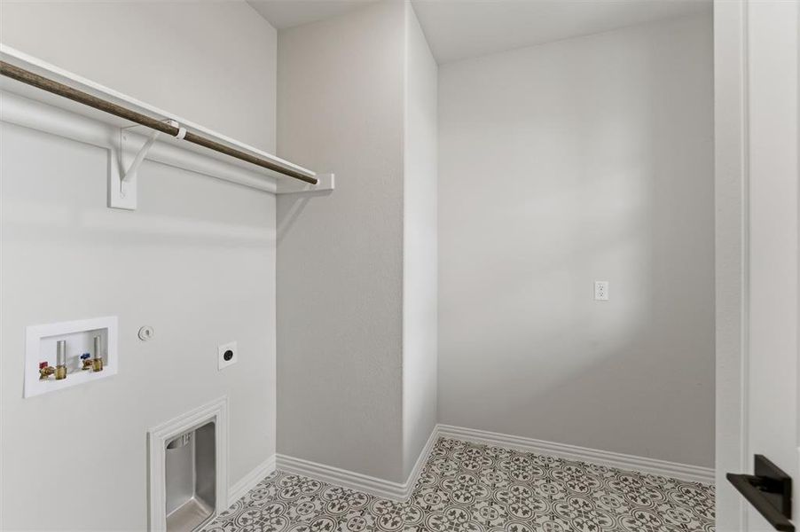 Laundry room with gas dryer hookup, hookup for an electric dryer, and washer hookup