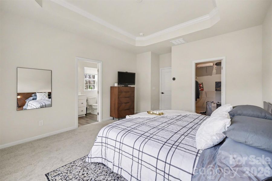 Primary bedroom convenient access to the ensuite bath & walk-in closet