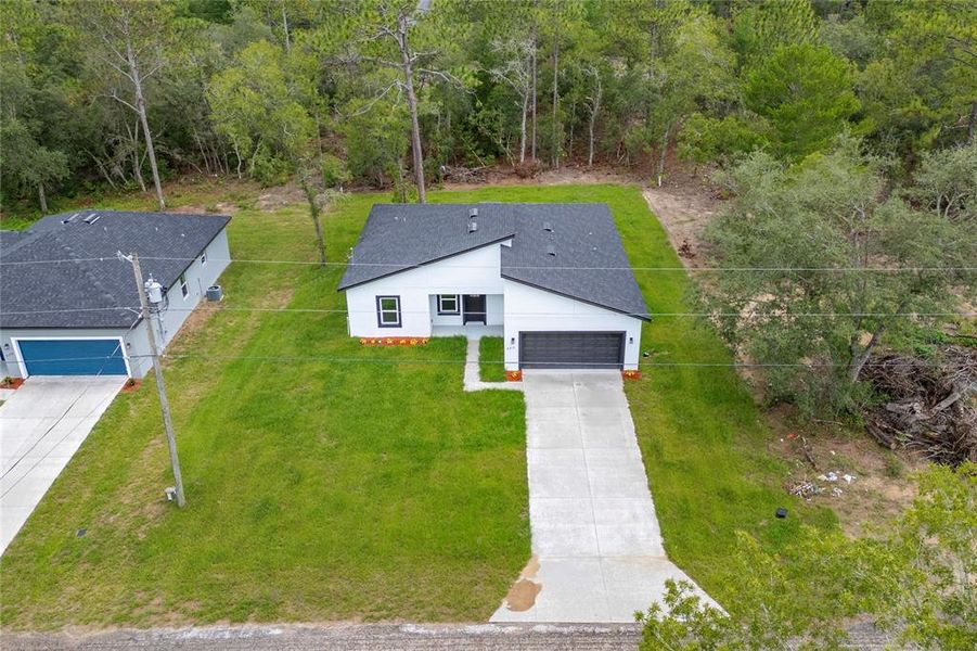 Front exterior of a new home in , Citrus Springs, FL, highlighting curb appeal (Image 16).
